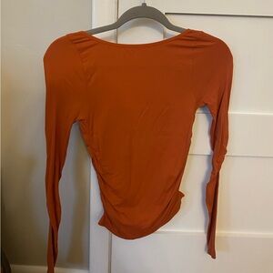 Free People Movement, orange long sleeve. Size XS/S